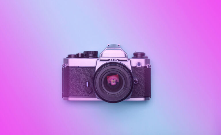 Photo of a camera on purple background