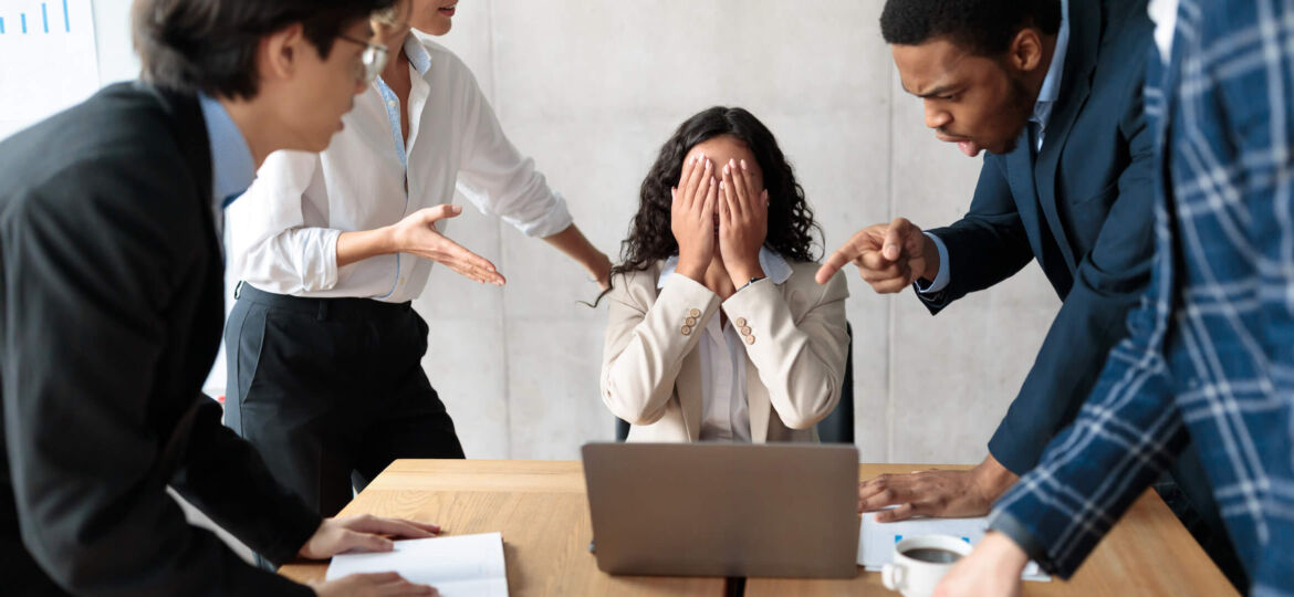 Displeased Business People Shouting At Unhappy Female Employee In Office