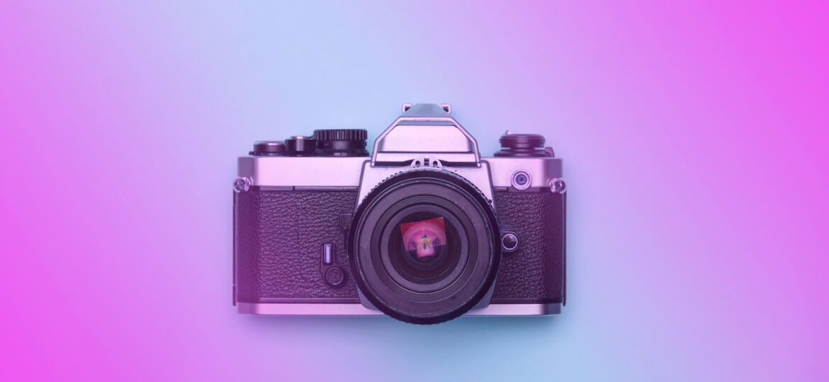 Photo of a camera on purple background